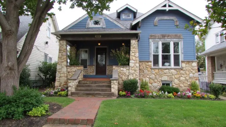 blue house with stone veneer