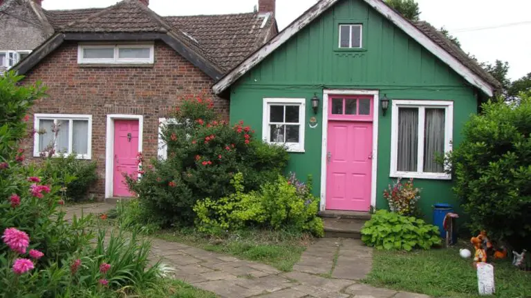 20 Green Houses With Pink Doors That Add Whimsy whimsical green houses doors