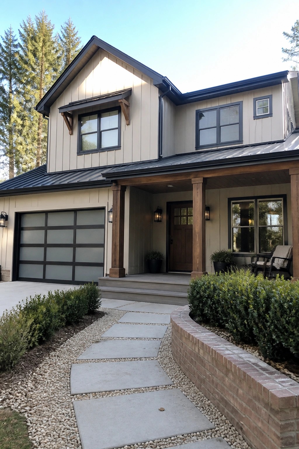 A two-story suburban house with beige siding, dark trim, a metal roof, wooden porch columns, and a stone pathway leading to the front door.