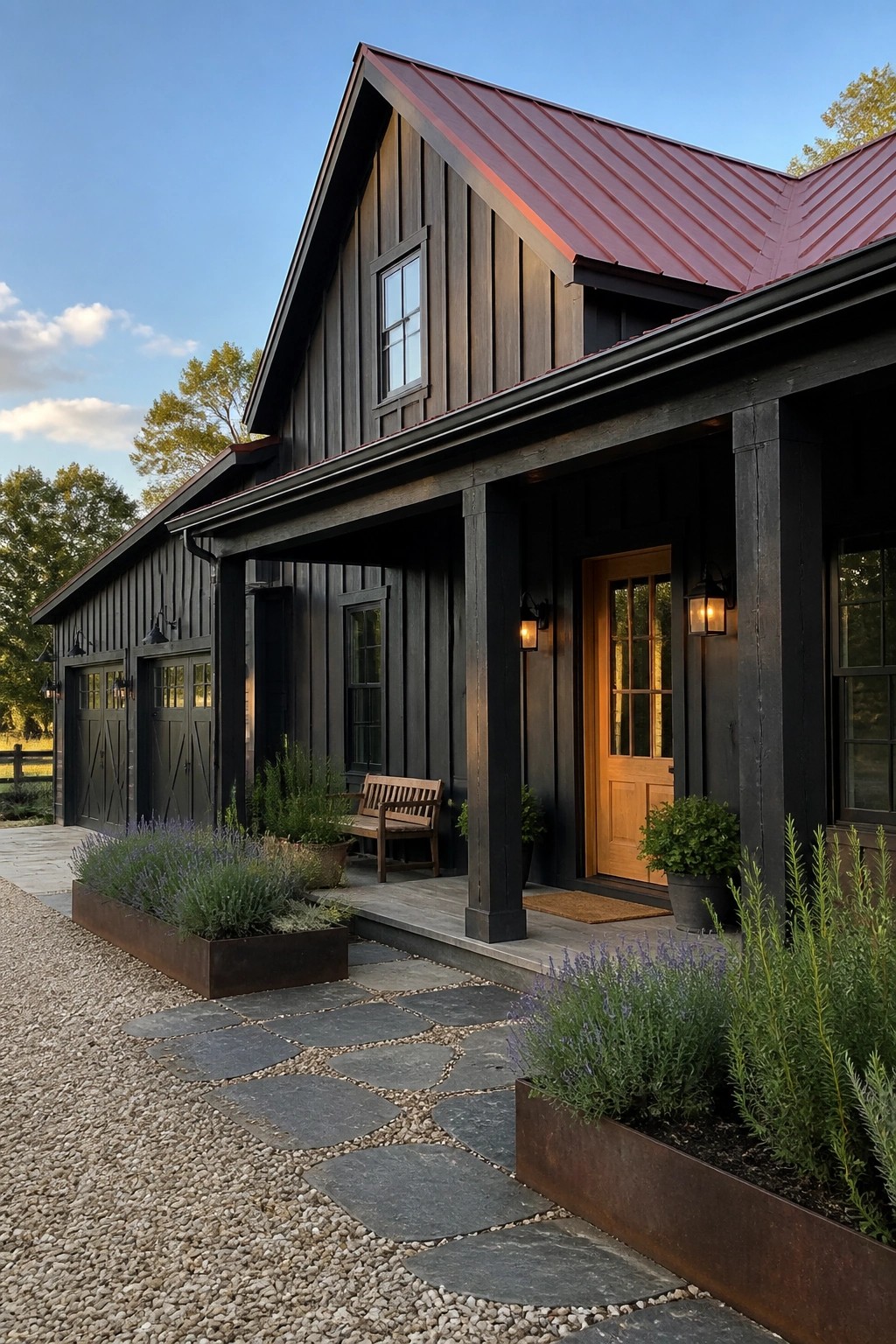 A black wood-sided house with a red metal roof, a covered front porch with a light wood door, and a stone path leading to the entrance.