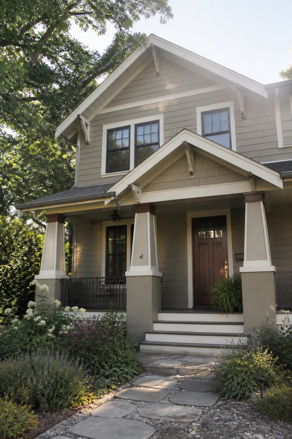 Craftsman house exterior painted in a muted greige with white trim.