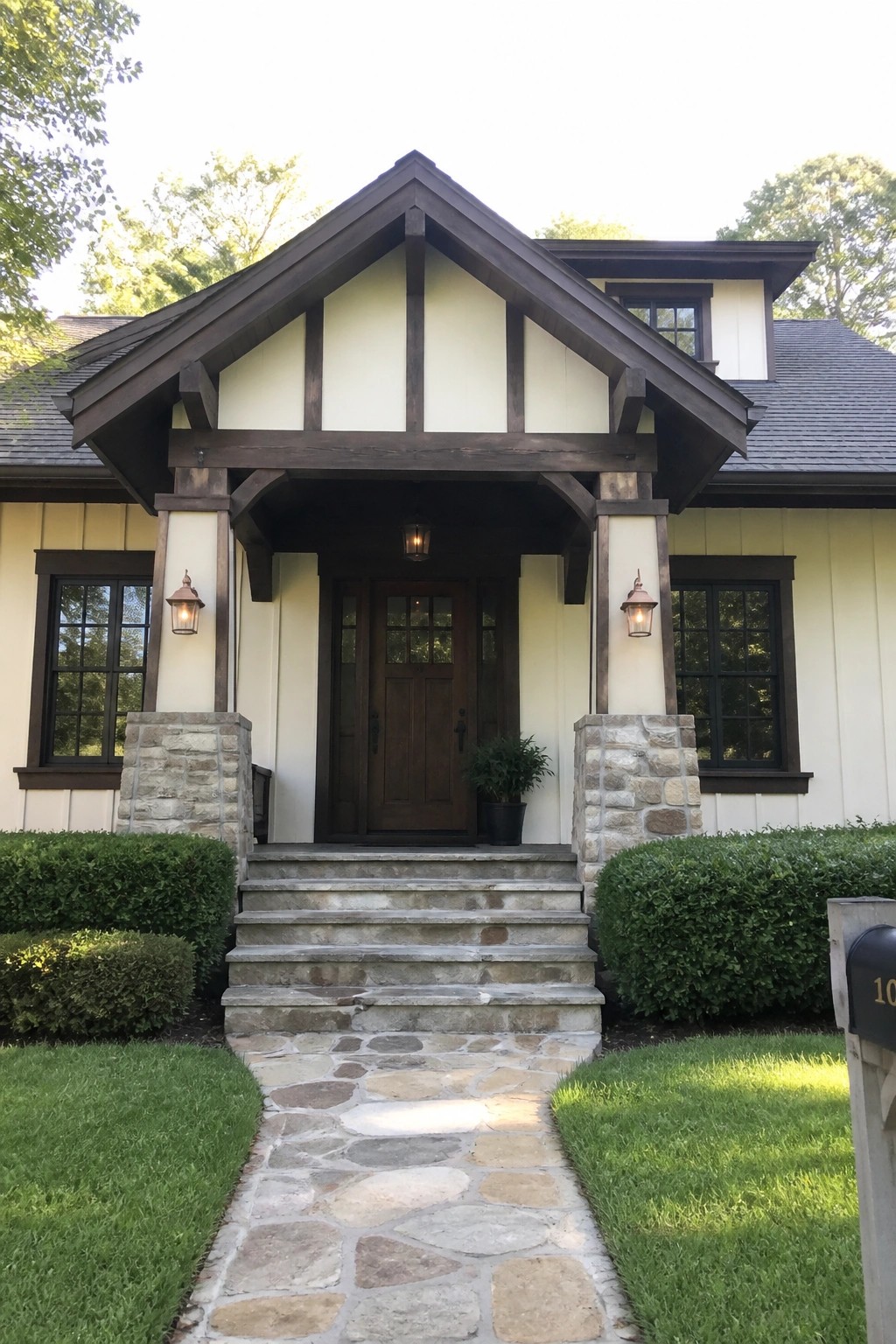 Craftsman house exterior with warm cream siding and prominent dark wood trim.