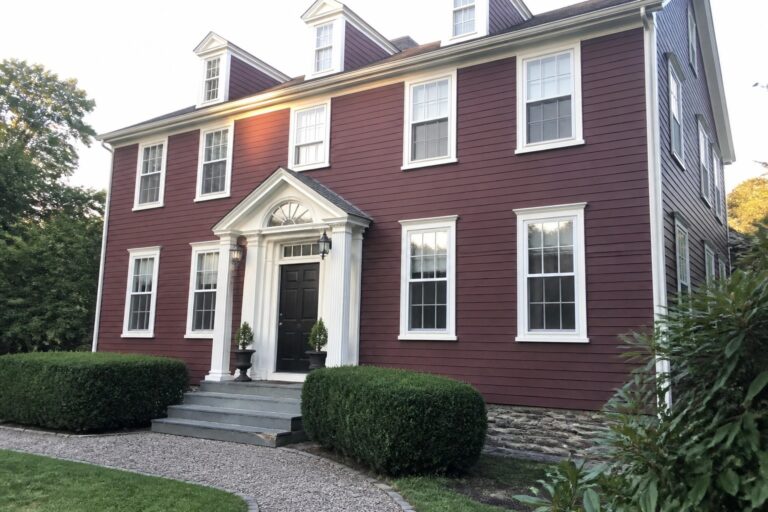 18 Sophisticated Burgundy and White House Exteriors Featuring Crisp Window Trim Maroon colonial house with white trim, black door, and columned portico.