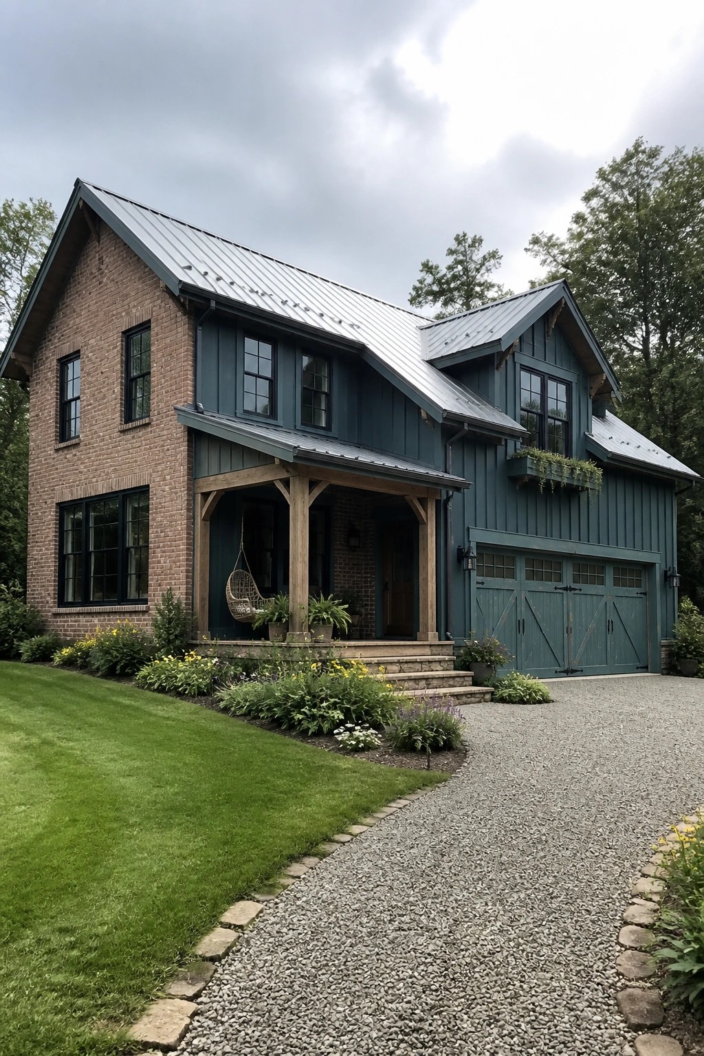 Two-story brick and teal house with metal roof, porch, and gravel driveway