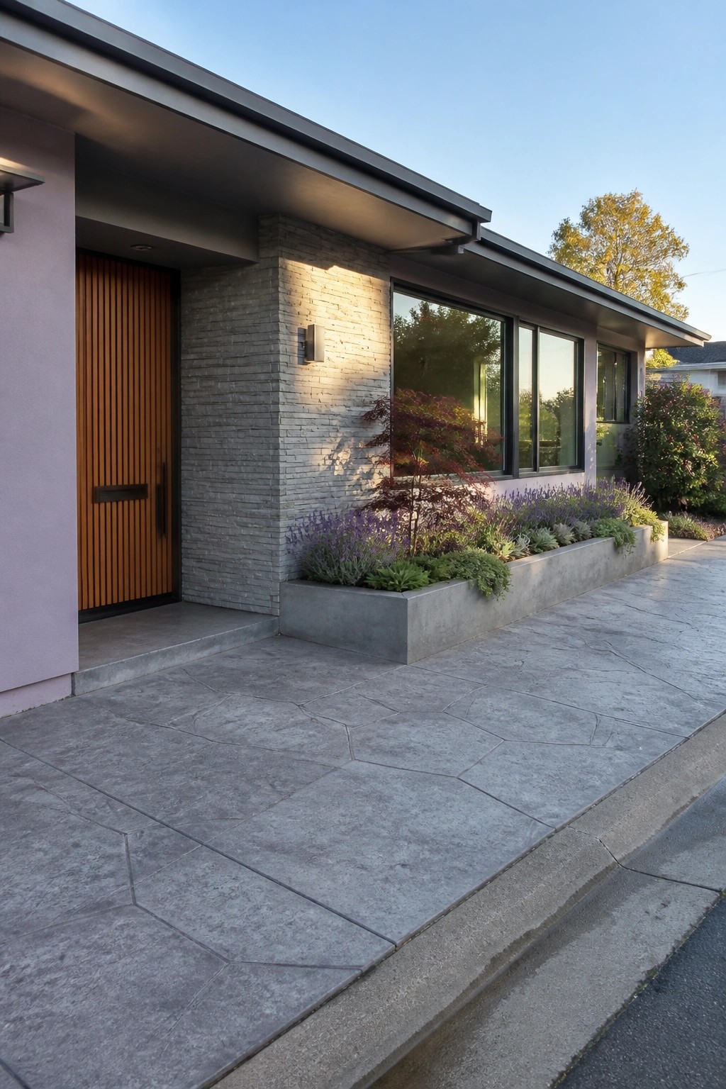 Modern home with purple wall, orange slatted door, stone facade, and flower-filled planter.