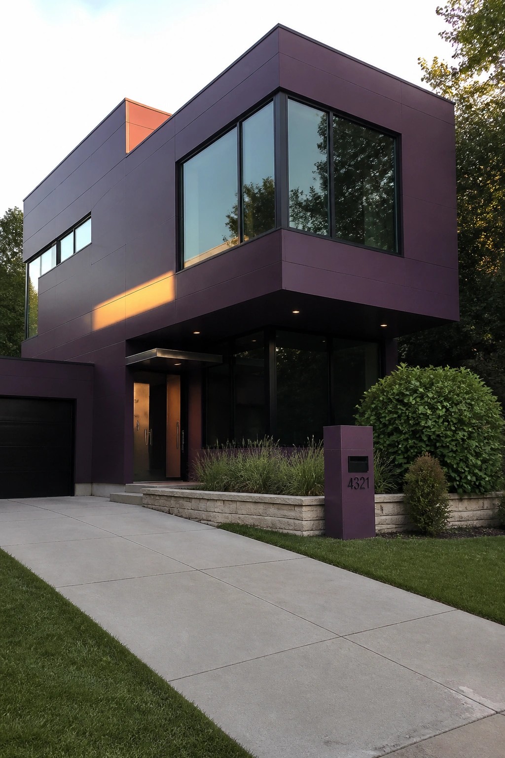 Modern purple house with large windows, concrete driveway, stone wall, and 4321 mailbox