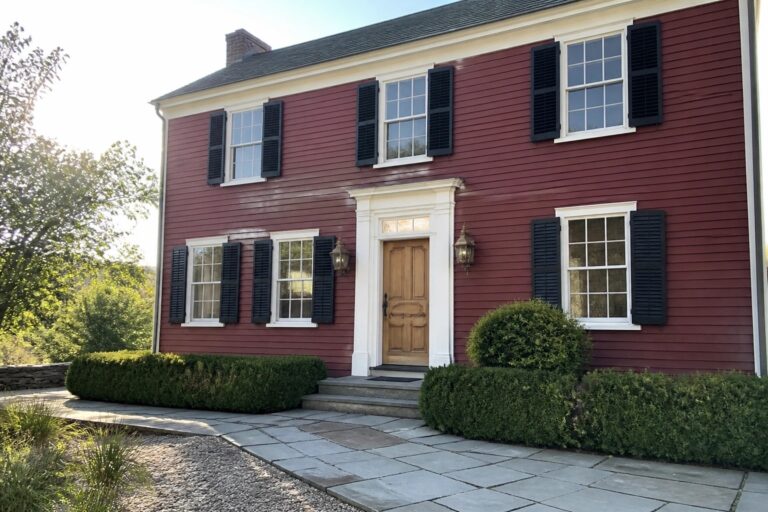 22 Deep Burgundy House Exteriors Built Around Black Shutters Red two-story house with black shutters, white trim, wooden door and stone path