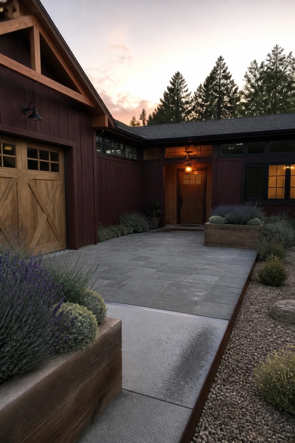 Rustic dark red wooden house with stone patio, lavender planters, and sunset sky.