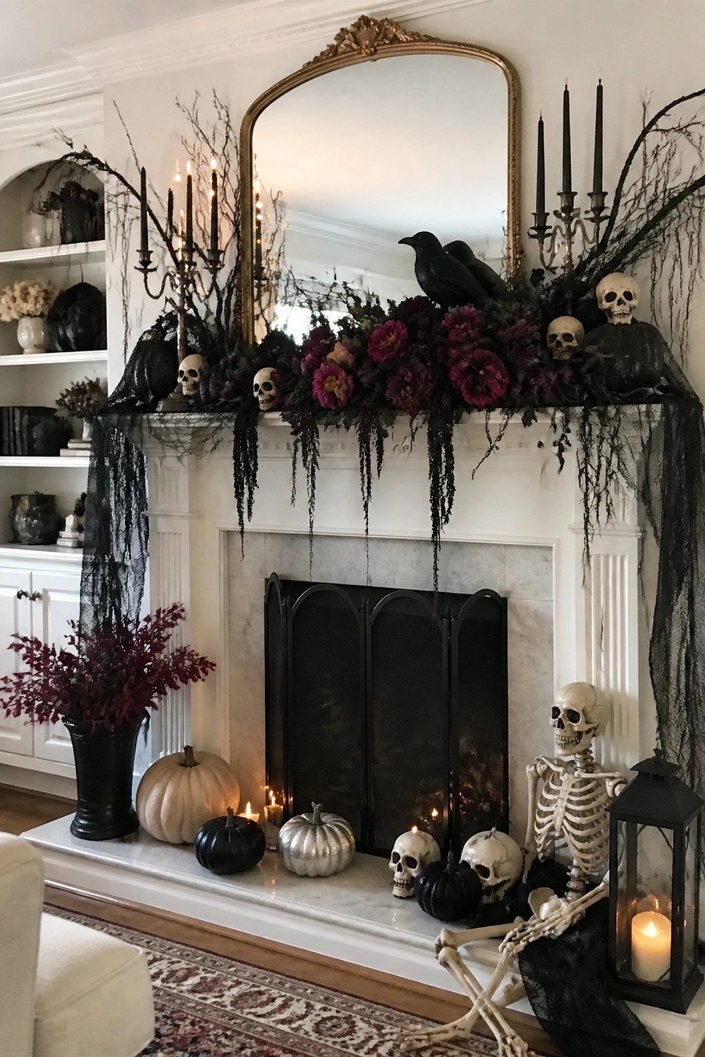 White fireplace mantel styled with human skulls, black crows, dark flowers, and black branches for Halloween.