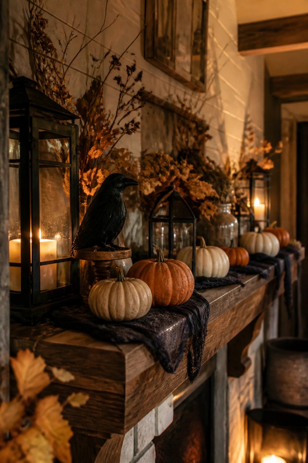 Farmhouse fireplace mantel styled with a black crow figurine, orange and white pumpkins, black lanterns, and dried foliage.